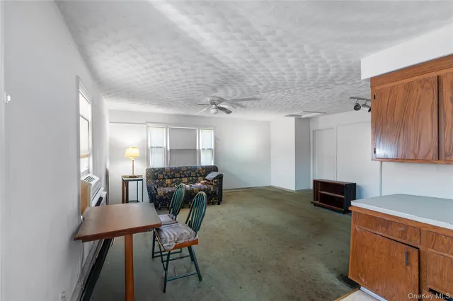 a bed room with furniture and a chair