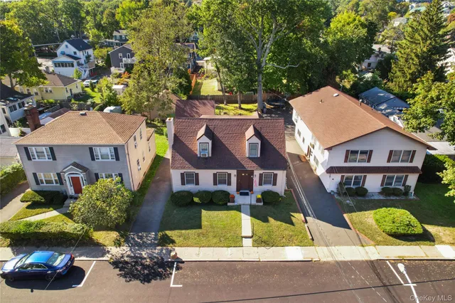 a view of multiple houses with a yard