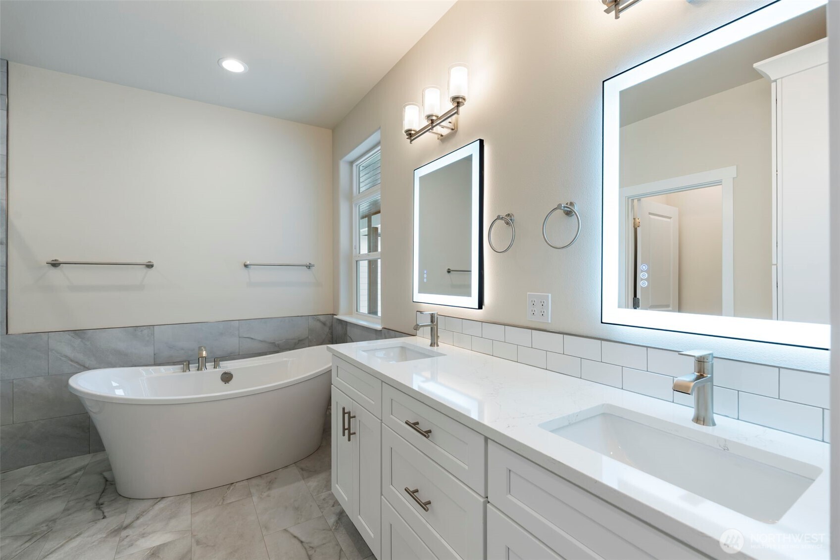 841 Barbara Lane, Unit SW Centralia, WA 98531 - Photo 13 of 28 a bathroom with a bathtub a double vanity sink and mirror