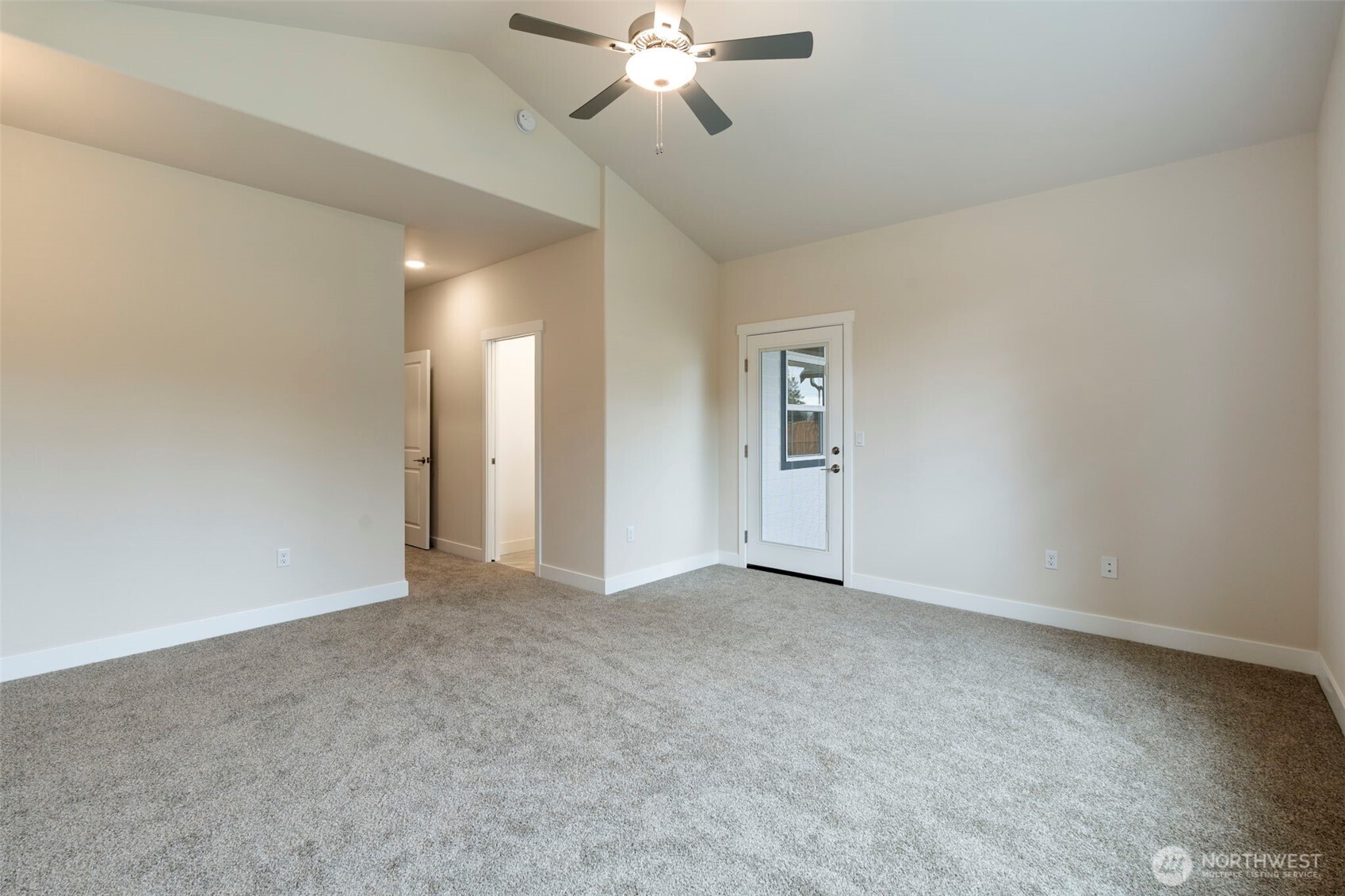 841 Barbara Lane, Unit SW Centralia, WA 98531 - Photo 15 of 28 an empty room with chandelier fan and windows