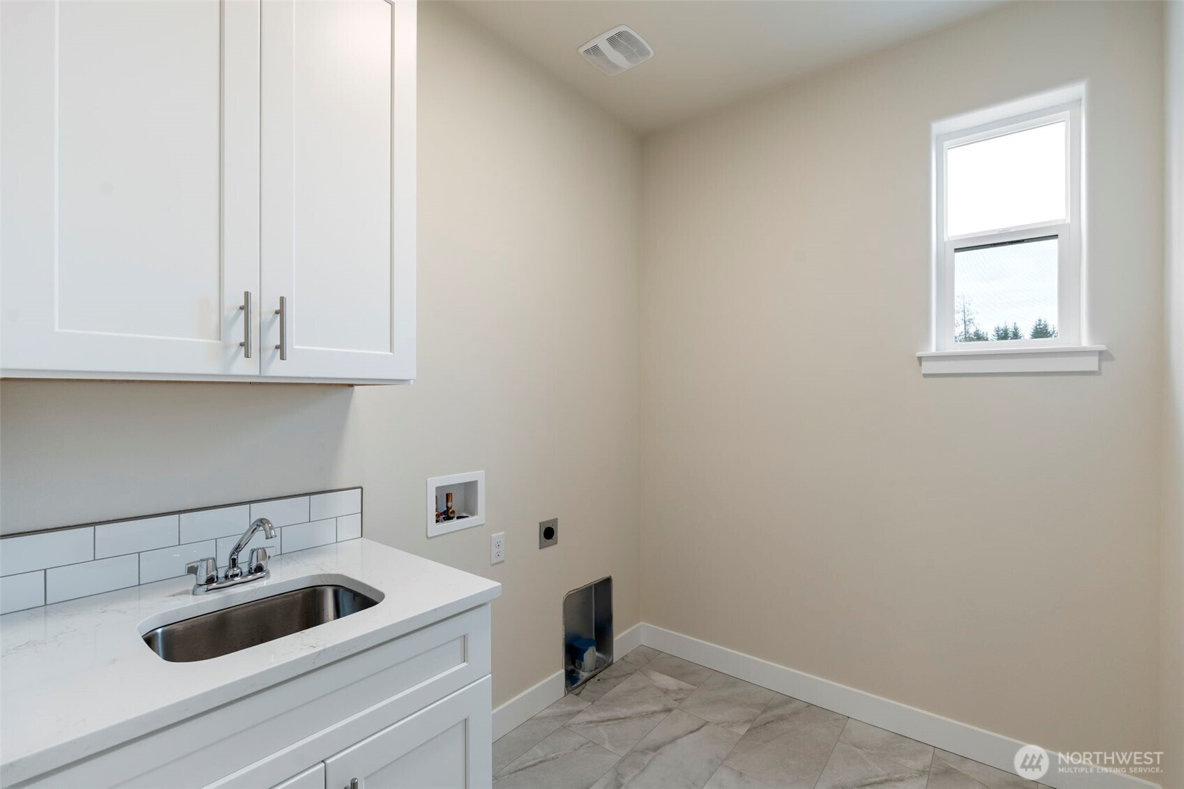 841 Barbara Lane, Unit SW Centralia, WA 98531 - Photo 18 of 28 a bathroom with a sink and cabinets