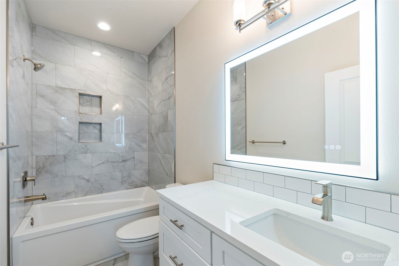 841 Barbara Lane, Unit SW Centralia, WA 98531 - Photo 19 of 28 a bathroom with a bathtub shower sink vanity mirror and toilet