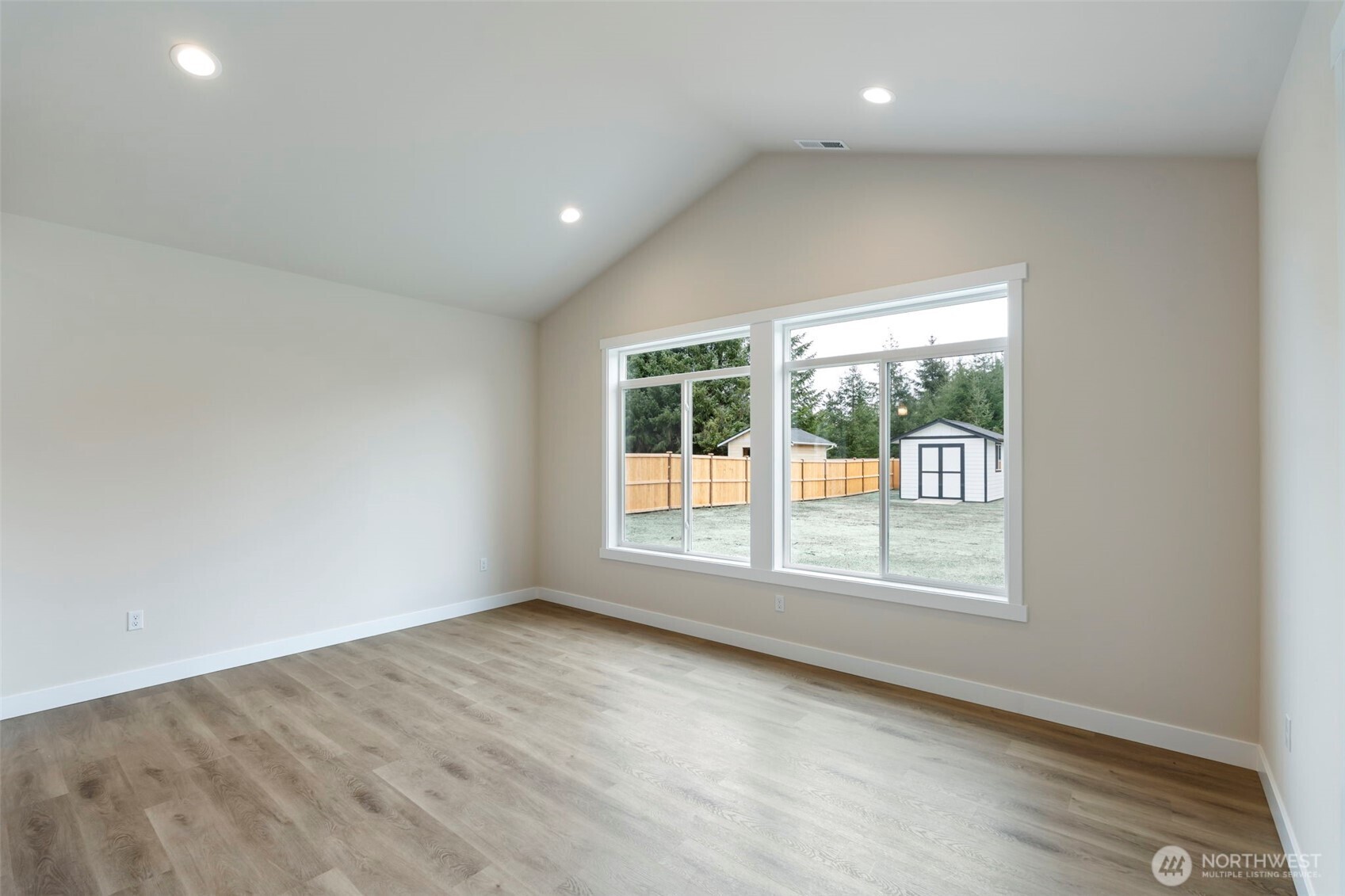 841 Barbara Lane, Unit SW Centralia, WA 98531 - Photo 10 of 28 an empty room with wooden floor and windows