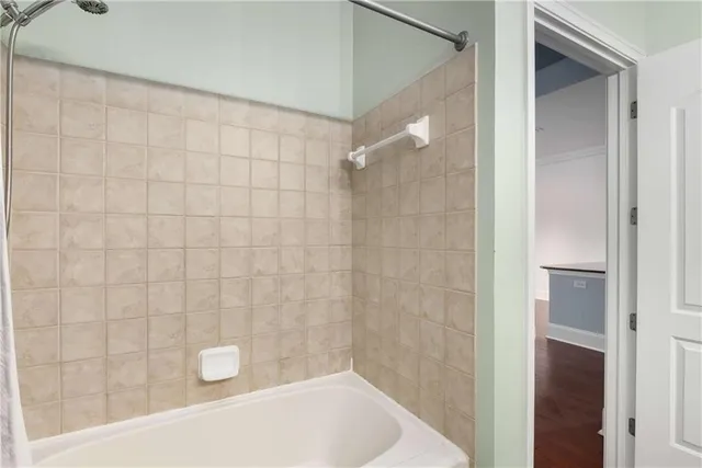 a bathroom with a shower and a bathtub
