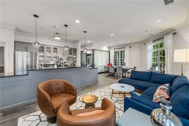 a kitchen with stainless steel appliances granite countertop a stove and a refrigerator