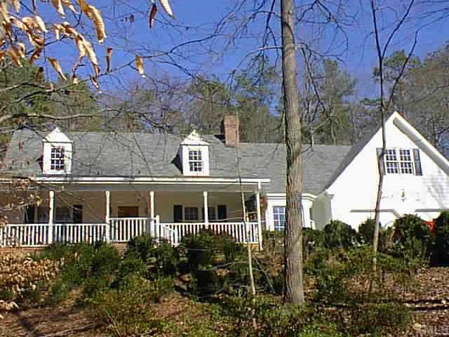 4700 Oak Park Road Raleigh, NC 27612 - Photo 1 of 1 a view of a house with a small yard and plants