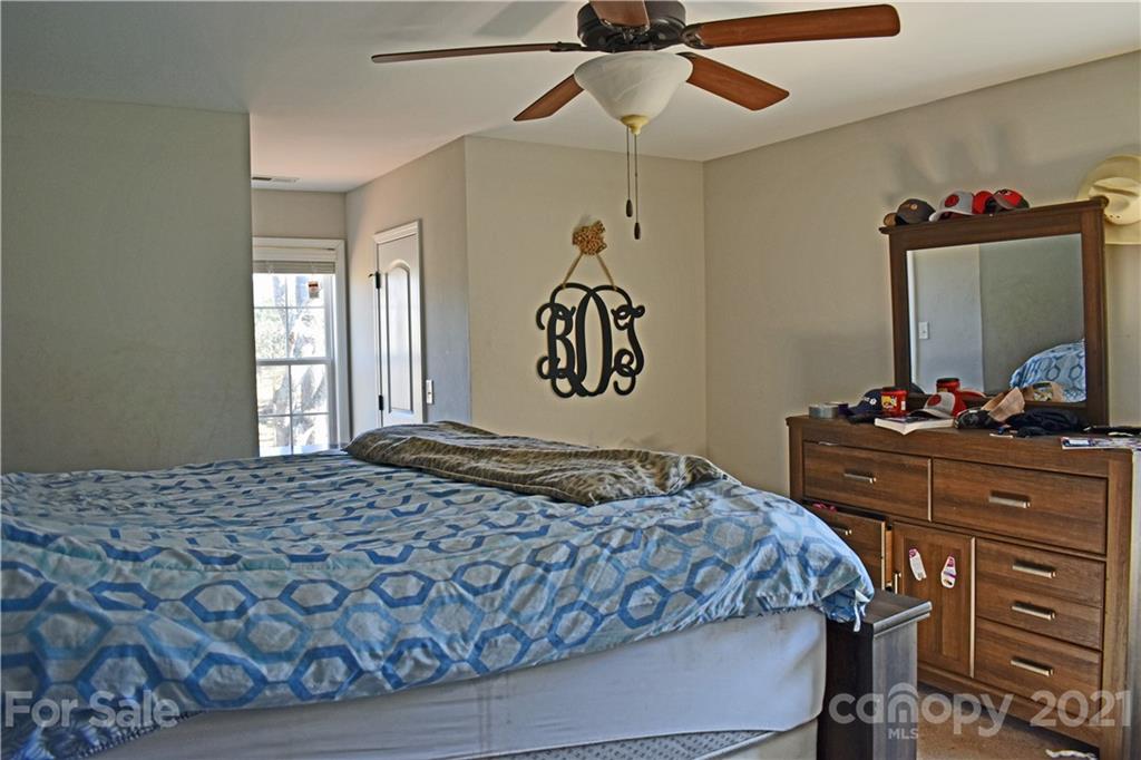 1817 St Marks Church Road Crouse, NC 28033 - Photo 20 of 35 a bedroom with a bed and a dresser