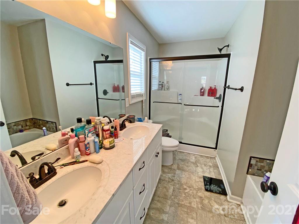 1817 St Marks Church Road Crouse, NC 28033 - Photo 21 of 35 a bathroom with a tub sink and mirror