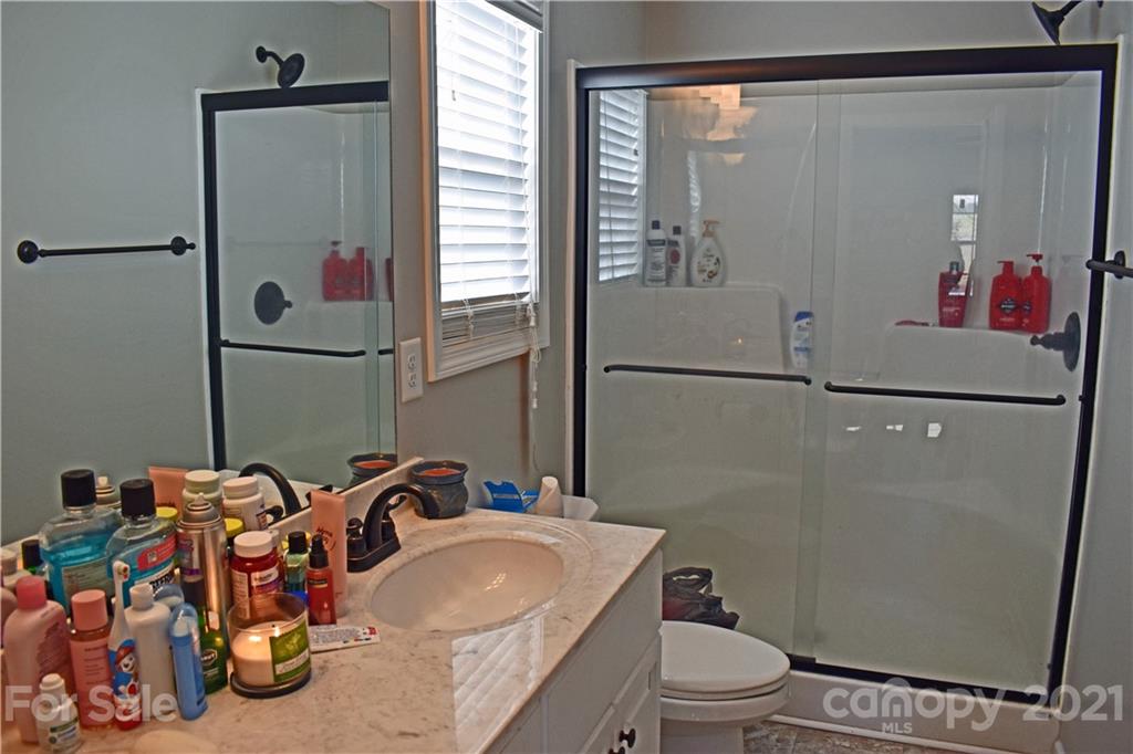 1817 St Marks Church Road Crouse, NC 28033 - Photo 22 of 35 a bathroom with a toilet a sink and a mirror