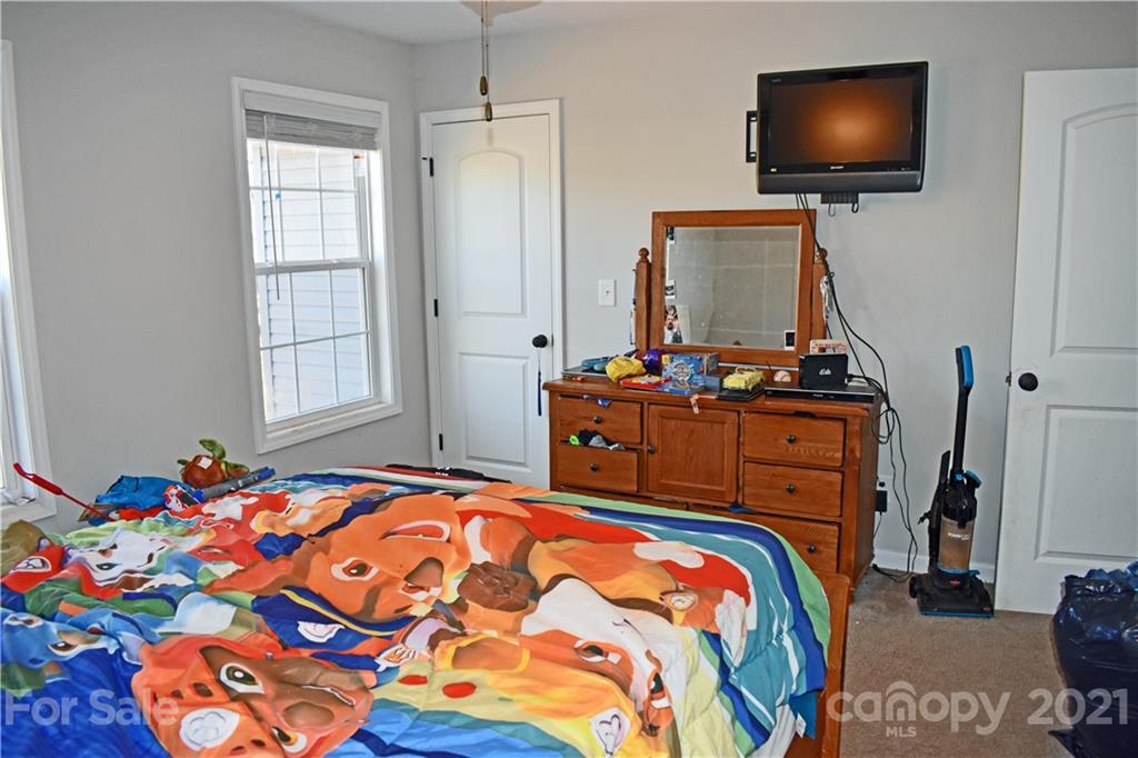 1817 St Marks Church Road Crouse, NC 28033 - Photo 25 of 35 a bedroom with a bed and flat screen tv