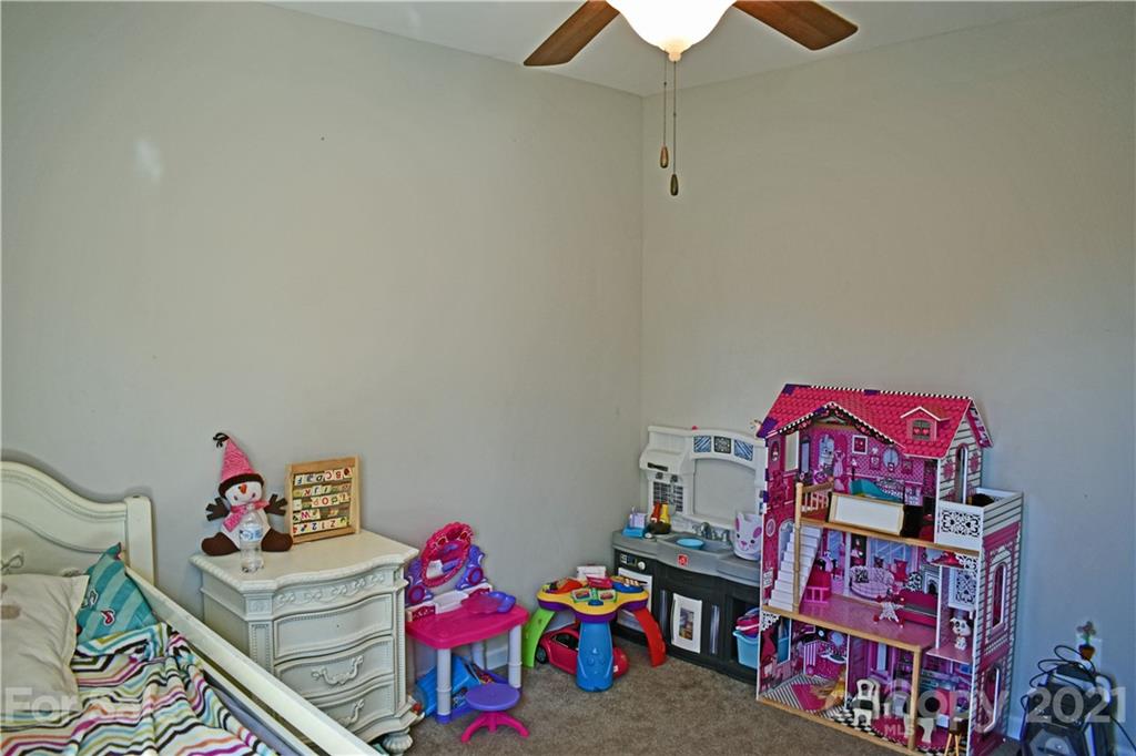 1817 St Marks Church Road Crouse, NC 28033 - Photo 31 of 35 a bedroom with a bed and a chandelier