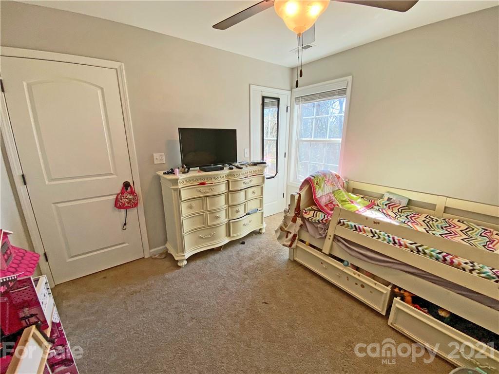 1817 St Marks Church Road Crouse, NC 28033 - Photo 32 of 35 a bedroom with furniture and flat screen tv