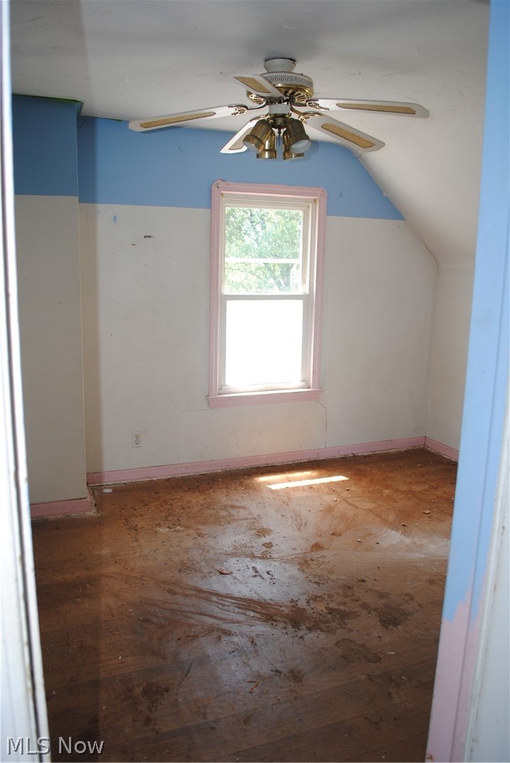 16110 Rockside Road Maple Heights, OH 44137 - Photo 3 of 17 Windowed room featuring an angled ceiling, wood-finish flooring, and a ceiling fan with integrated lighting