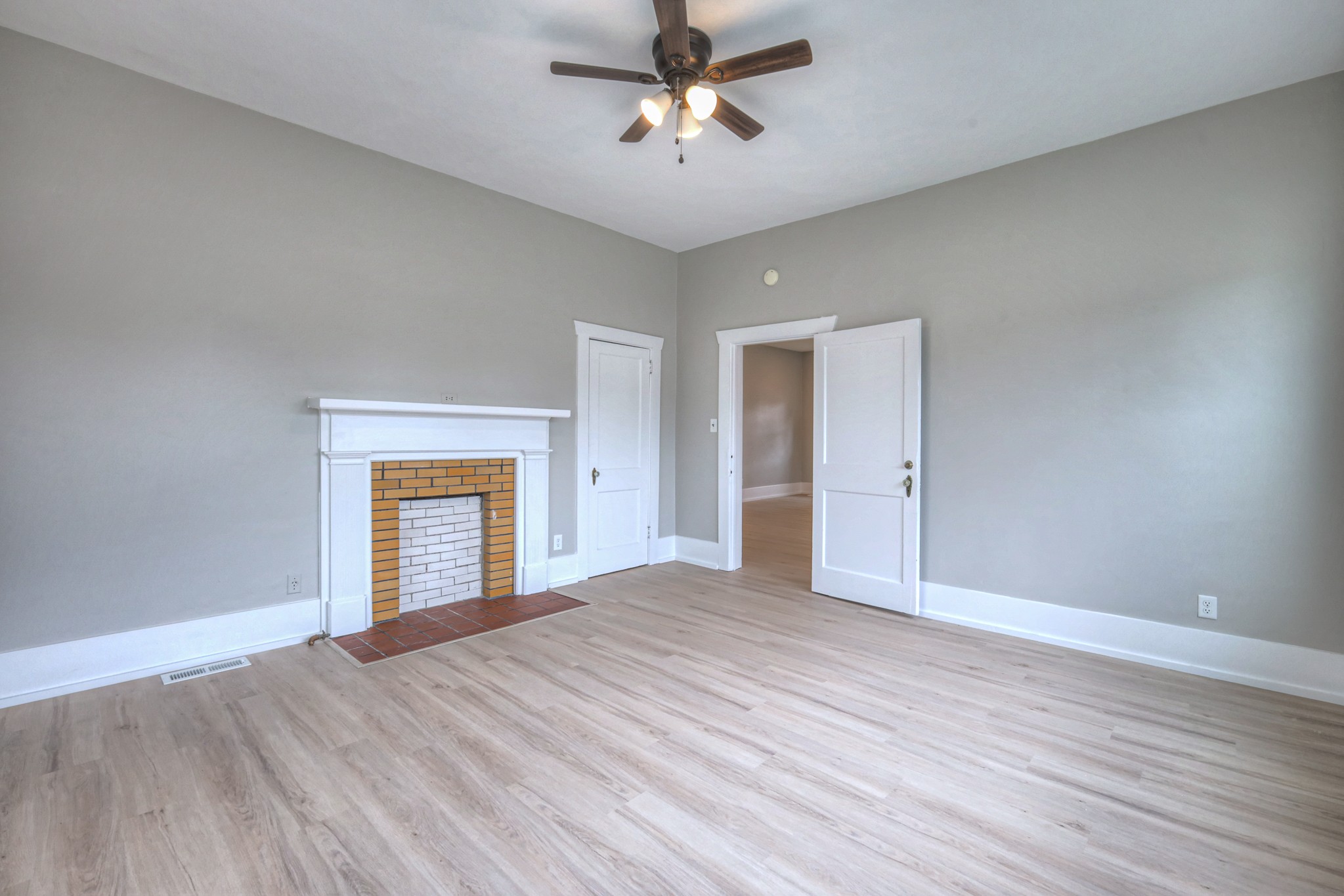 108 Church Street Mount Pleasant, TN 38474 - Photo 15 of 45 a view of an empty room with a window and a ceiling fan