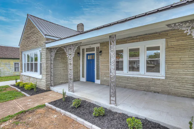 a front view of a house with garden