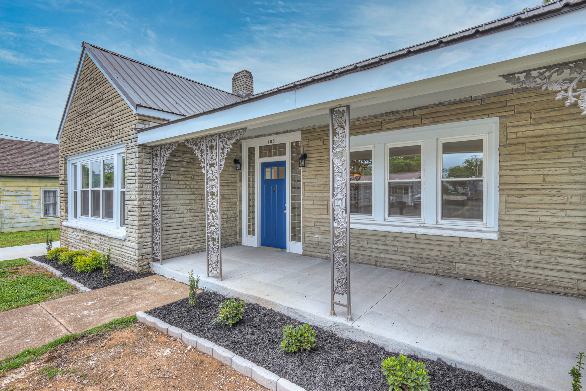 108 Church Street Mount Pleasant, TN 38474 - Photo 16 of 45 a front view of a house with garden