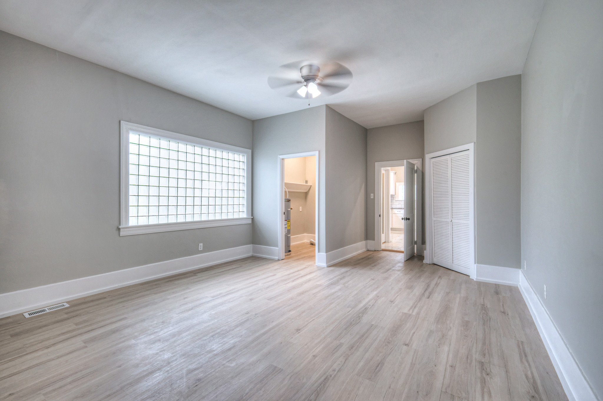 108 Church Street Mount Pleasant, TN 38474 - Photo 18 of 45 a view of an empty room with a window and wooden floor