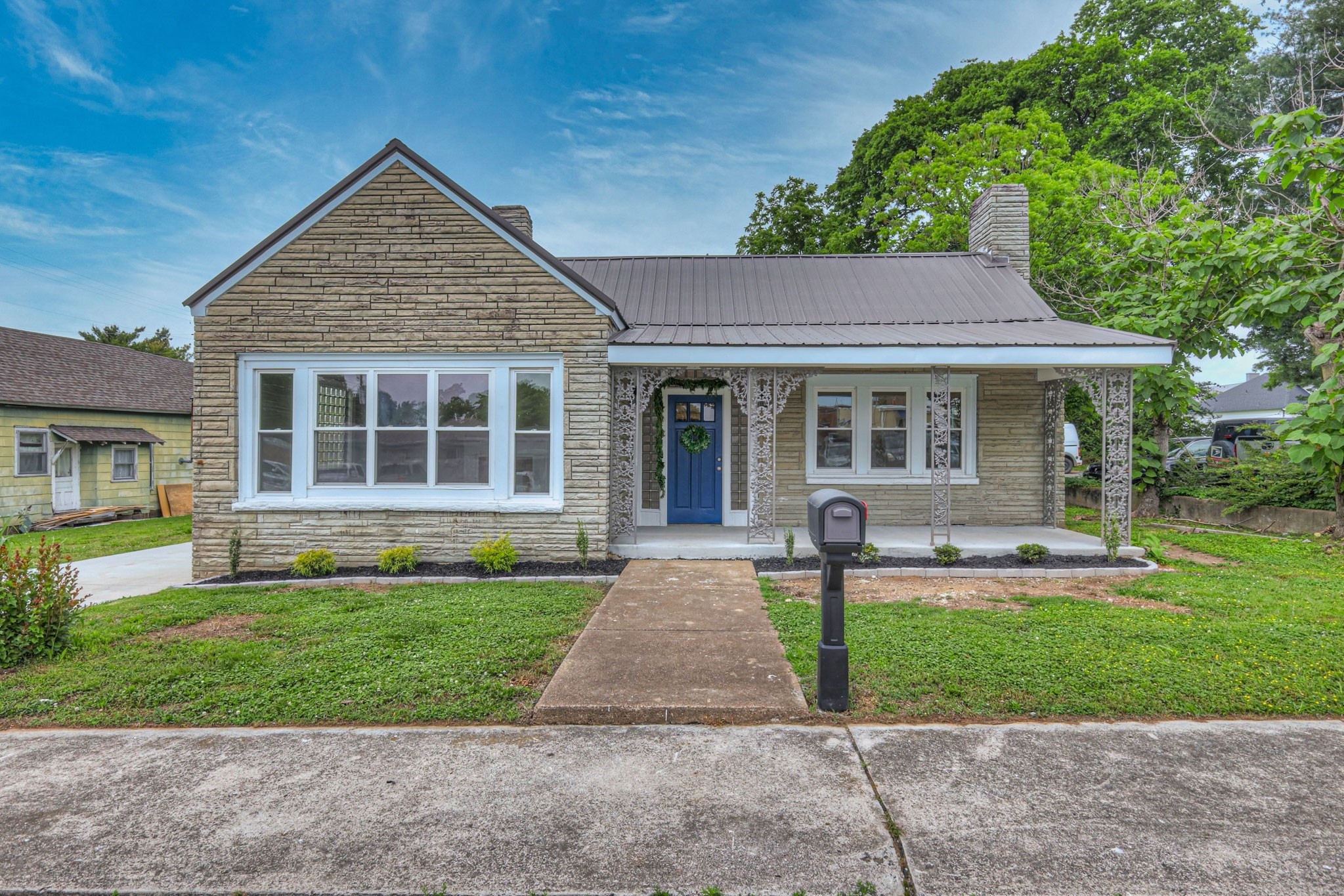 108 Church Street Mount Pleasant, TN 38474 - Photo 2 of 45 a front view of a house with a yard
