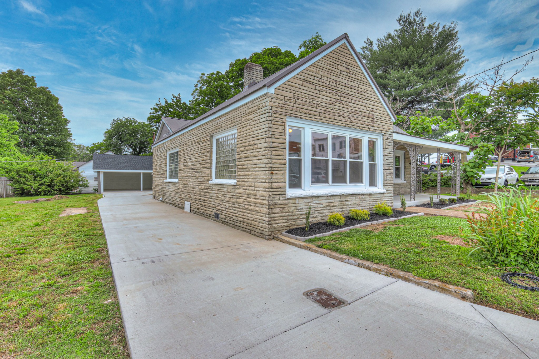 108 Church Street Mount Pleasant, TN 38474 - Photo 21 of 45 a view of a house with yard and a garden
