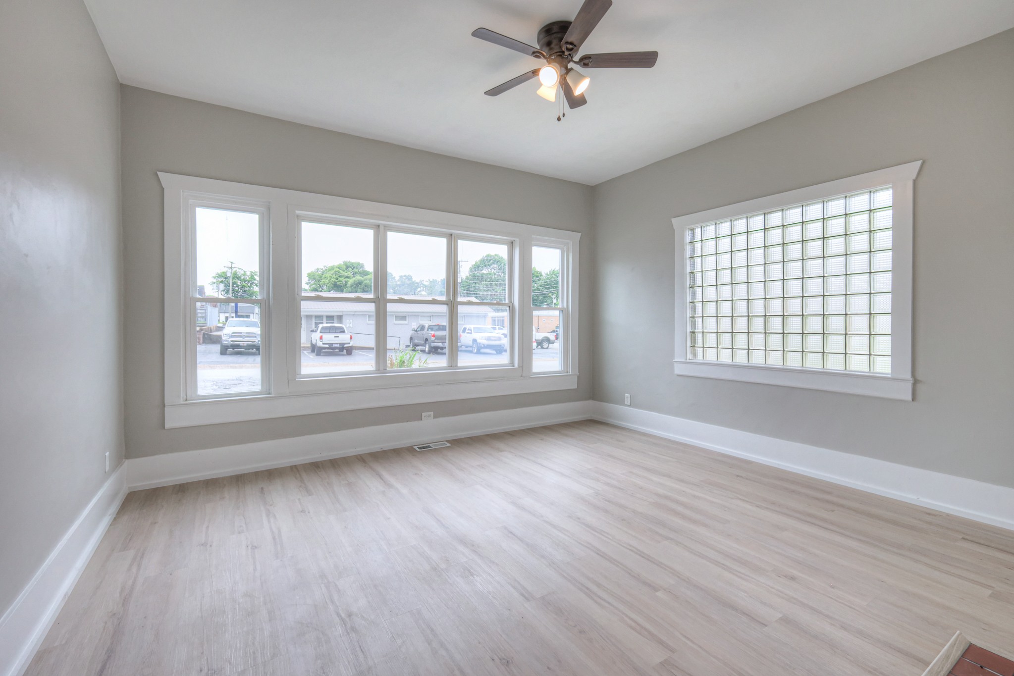 108 Church Street Mount Pleasant, TN 38474 - Photo 22 of 45 a view of empty room with wooden floor and fan