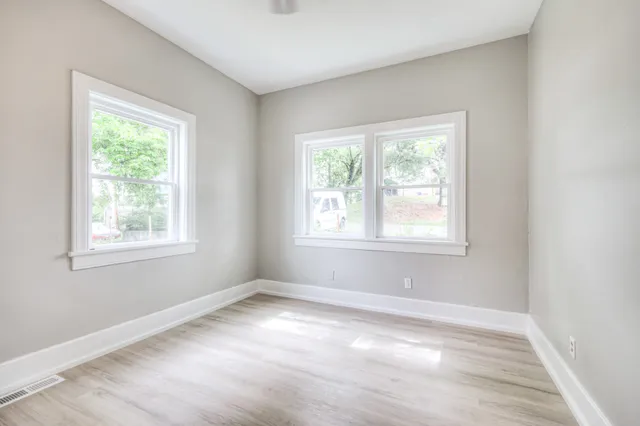 a view of a room with tiles and windows