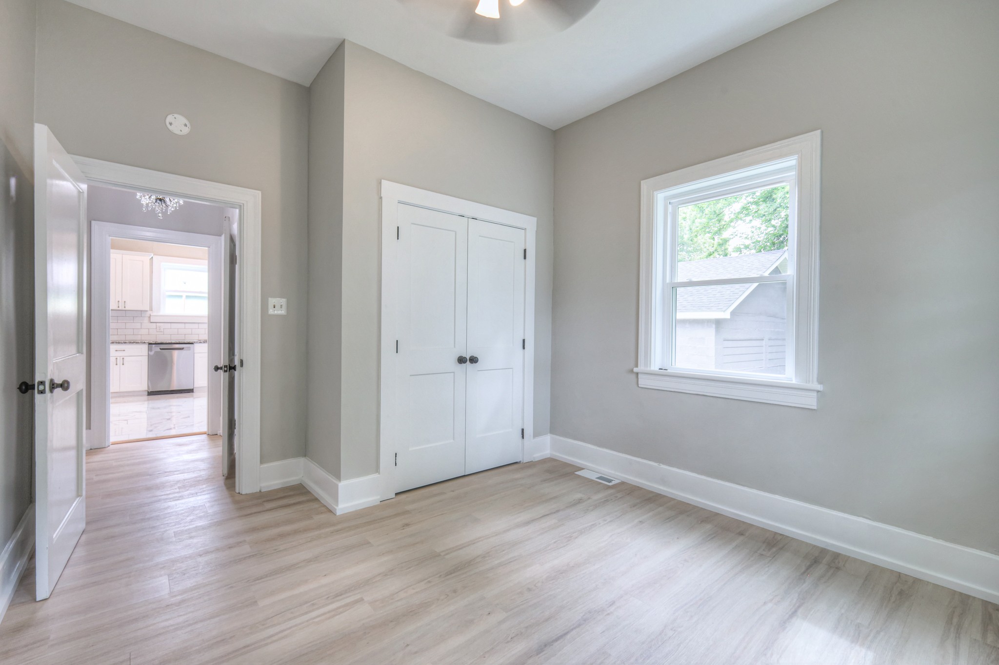 108 Church Street Mount Pleasant, TN 38474 - Photo 27 of 45 a view of an empty room with wooden floor and a window