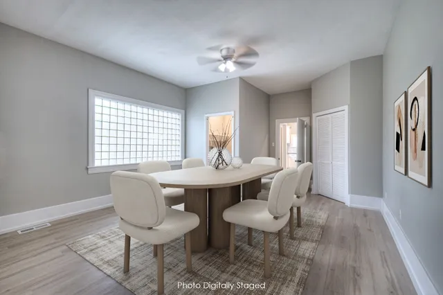 a view of a dining room with furniture and wooden floor
