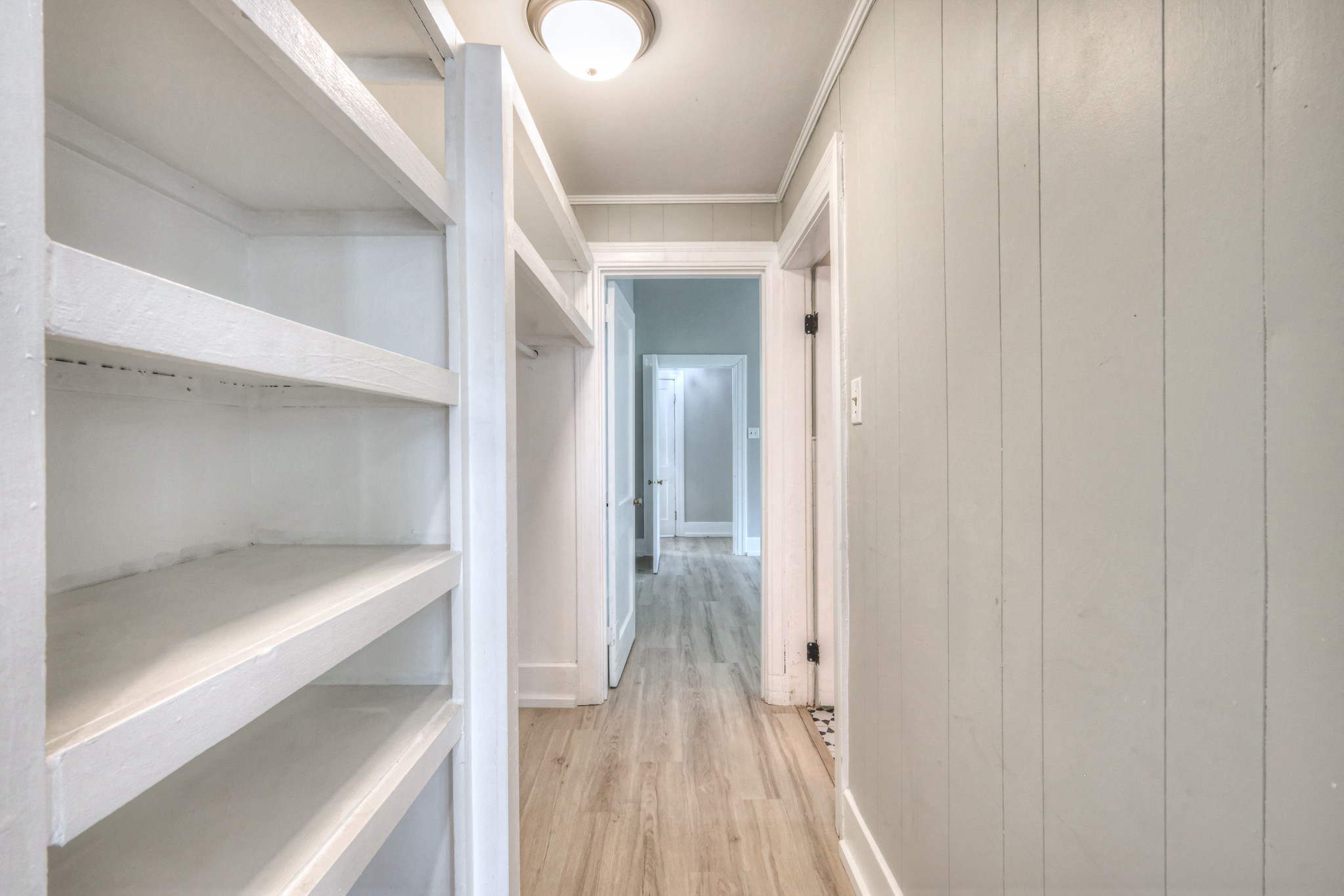 108 Church Street Mount Pleasant, TN 38474 - Photo 33 of 45 a view of a hallway with wooden floor and staircase