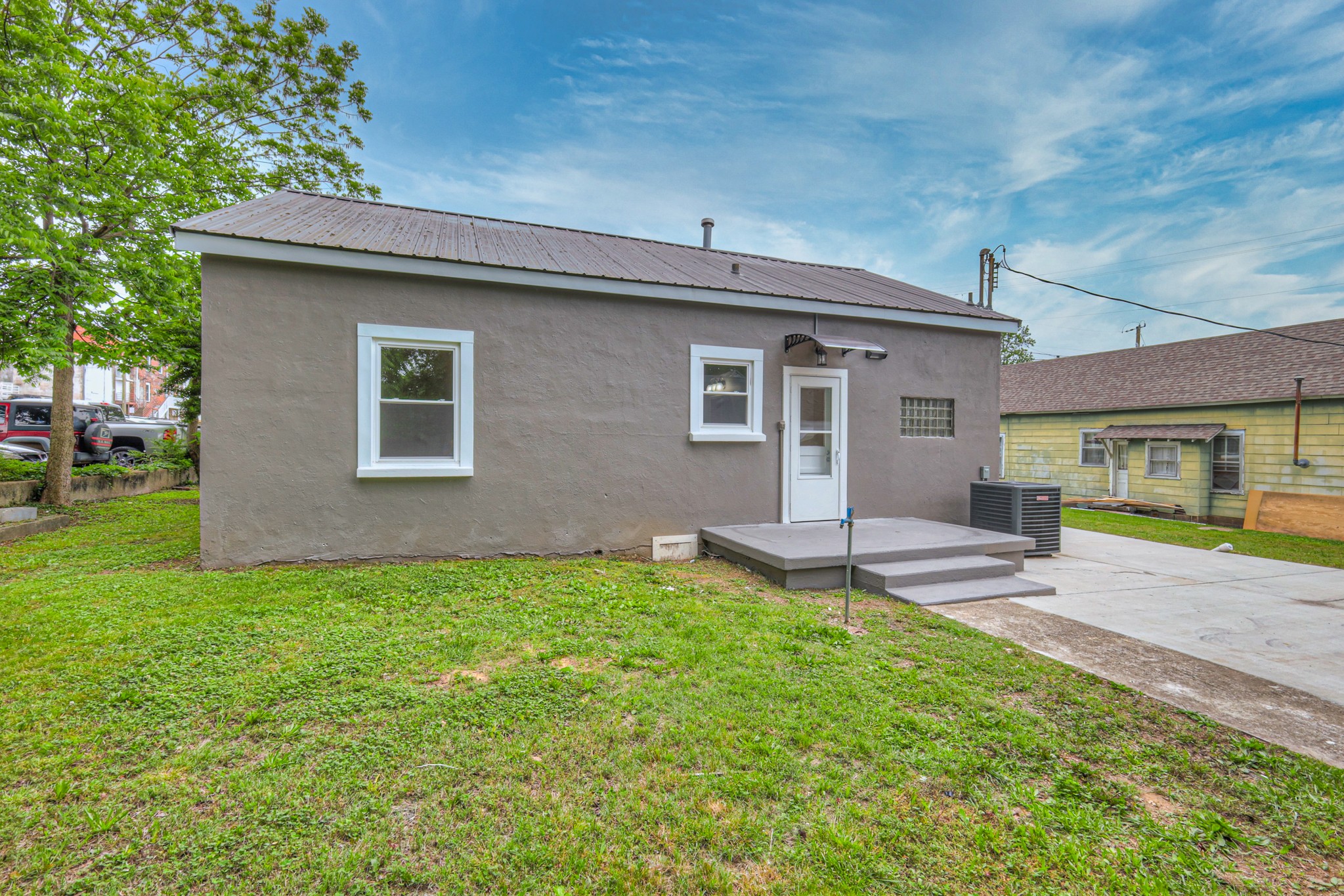 108 Church Street Mount Pleasant, TN 38474 - Photo 35 of 45 a view of a house with a yard and sitting area