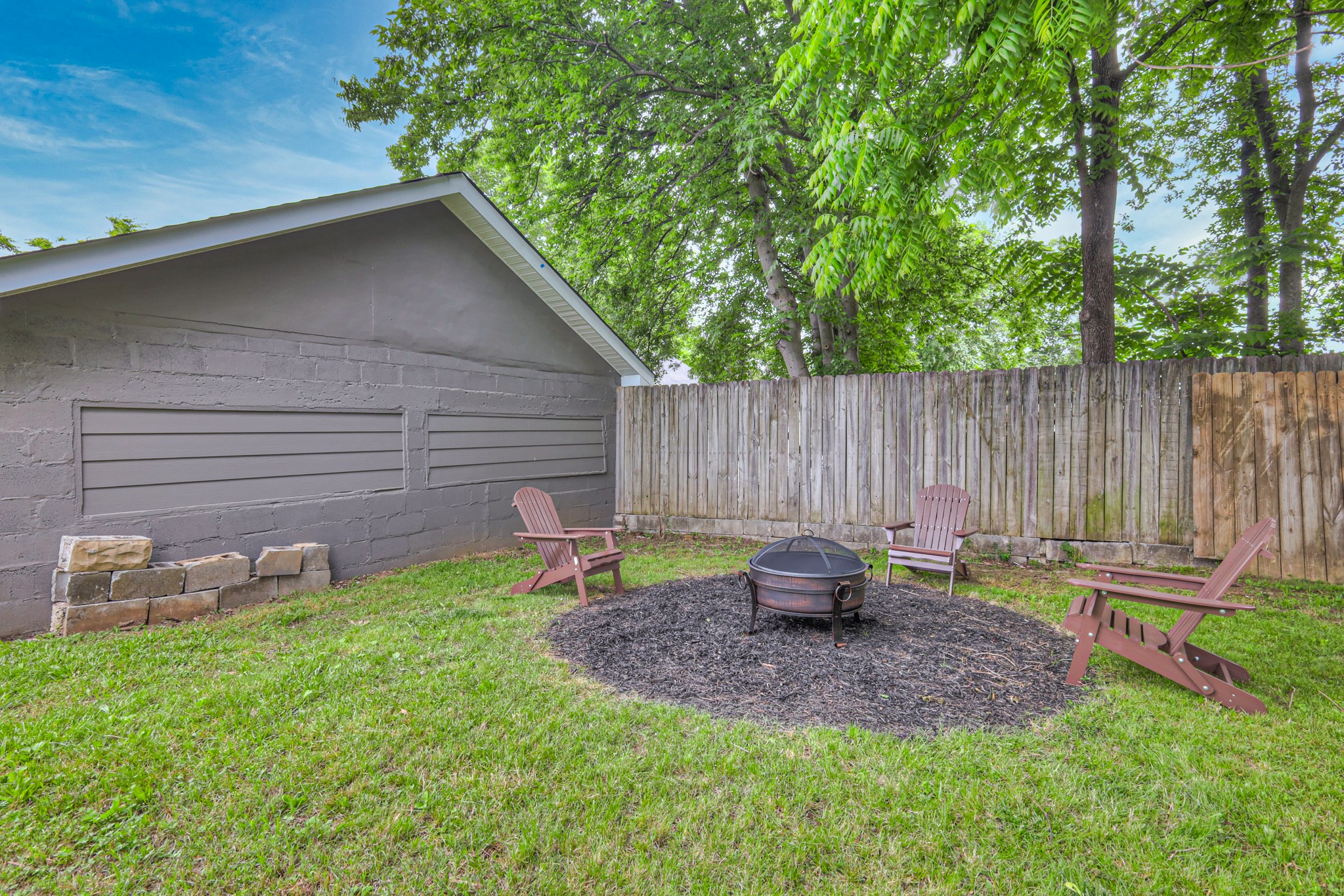 108 Church Street Mount Pleasant, TN 38474 - Photo 36 of 45 a backyard of a house with table and chairs