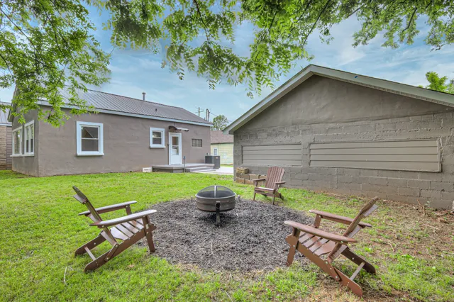 a backyard of a house with seating space