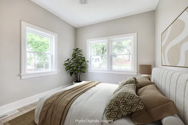 a bedroom with a bed and window