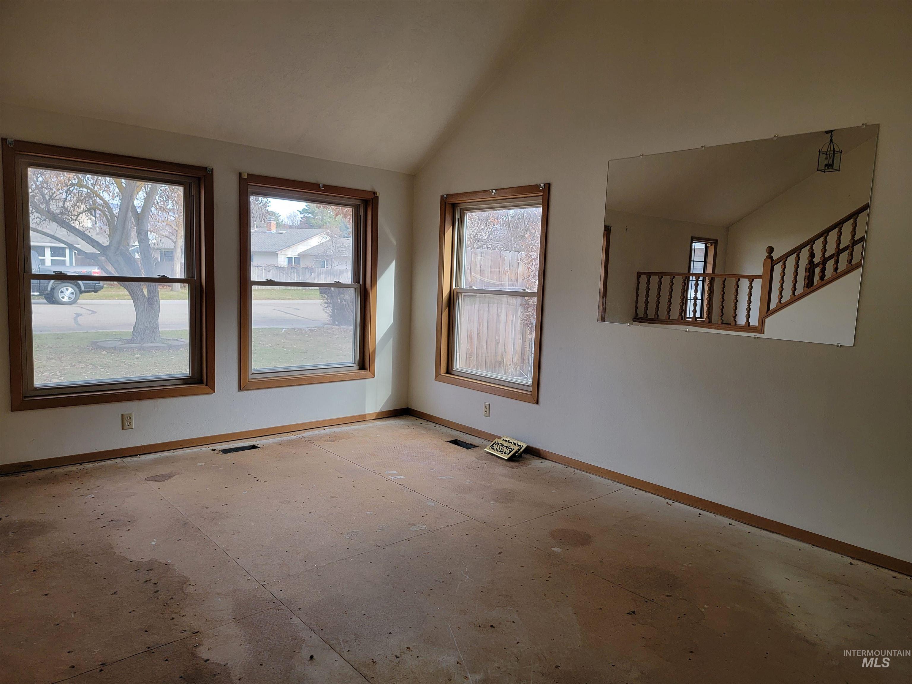 3311 Snowflake Way Boise, ID 83706 - Photo 4 of 14 Unfurnished room with baseboards and vaulted ceiling