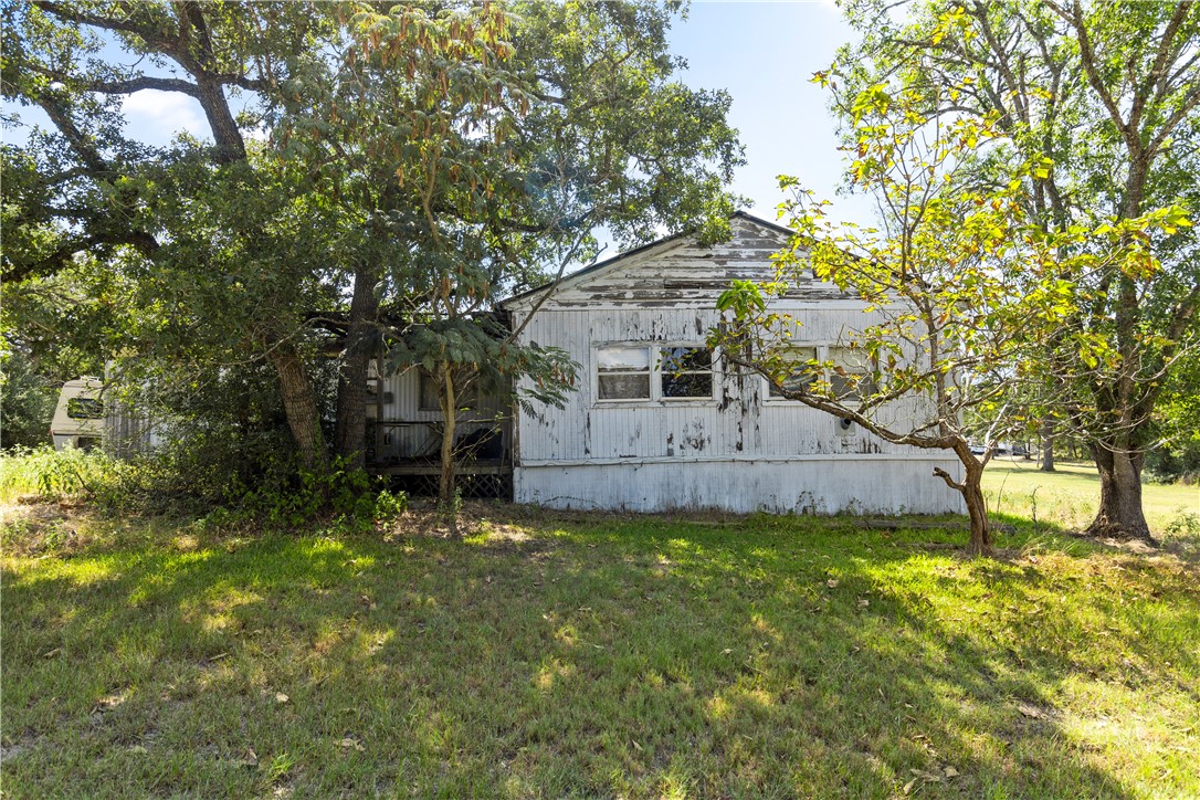 109 Mohawk Trail Somerville, TX 77879 - Photo 12 of 12 View of home's exterior featuring a yard