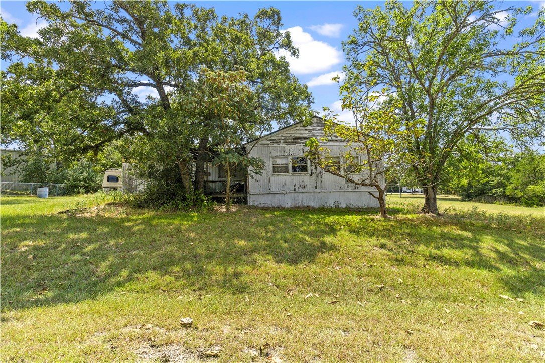 109 Mohawk Trail Somerville, TX 77879 - Photo 8 of 12 Rear view of house with a yard