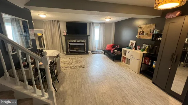 a view of a livingroom with furniture and a flat screen tv