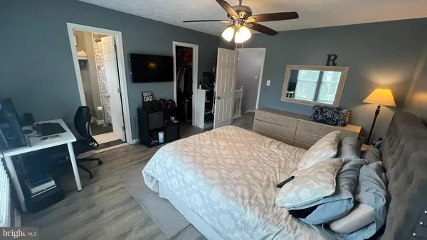 a bed room with a bed and a television