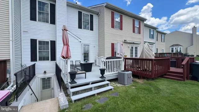 a view of a deck with furniture