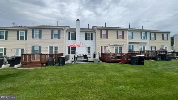 a group of cars parked in front of a house