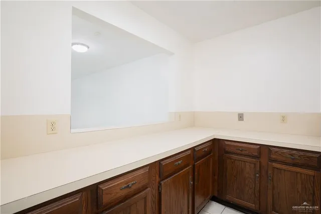 a kitchen with a sink and cabinets