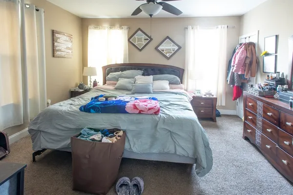 a bedroom with a bed and a table