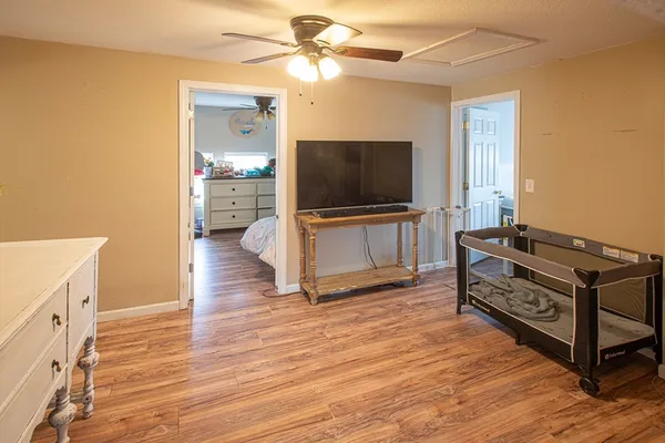 a bedroom with a bed and window