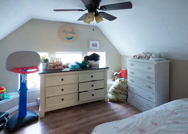 a bathroom with a sink toilet and window