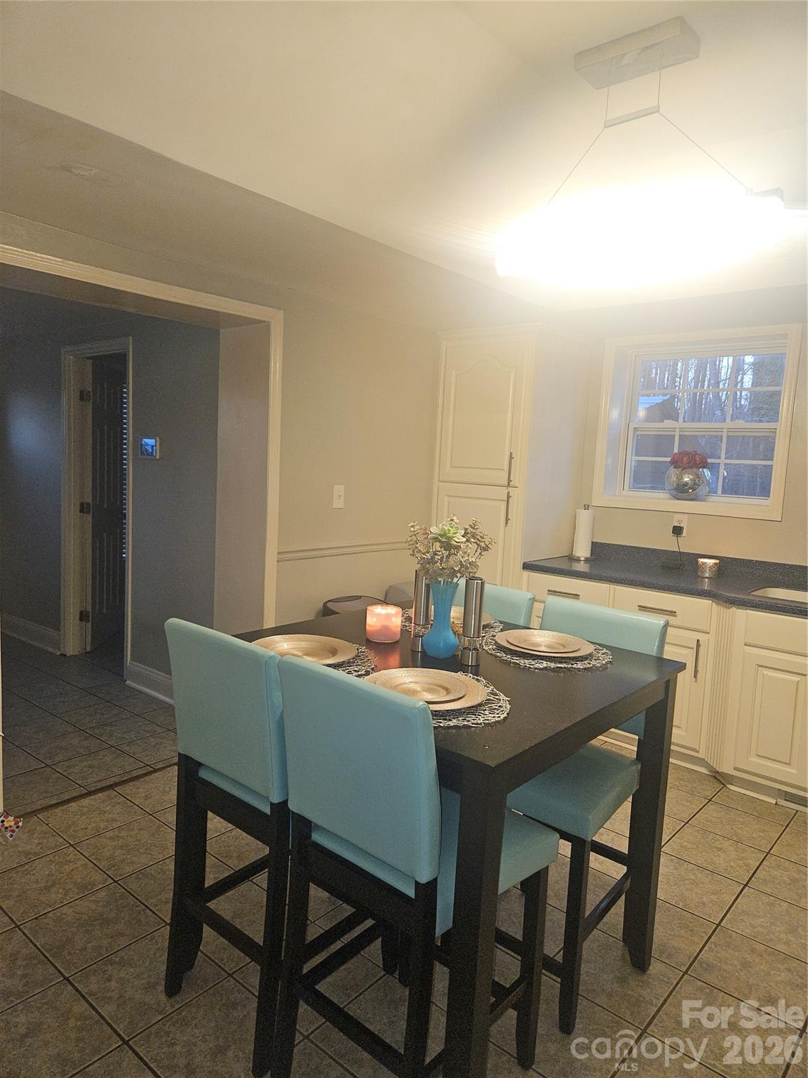 313 Mountain Creek Road Albemarle, NC 28001 - Photo 12 of 23 a view of a dining room with furniture