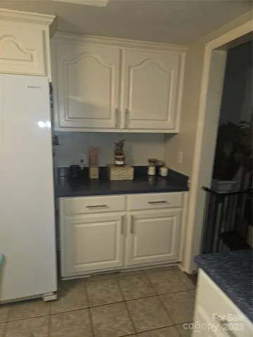 a kitchen with stainless steel appliances a sink stove and cabinets