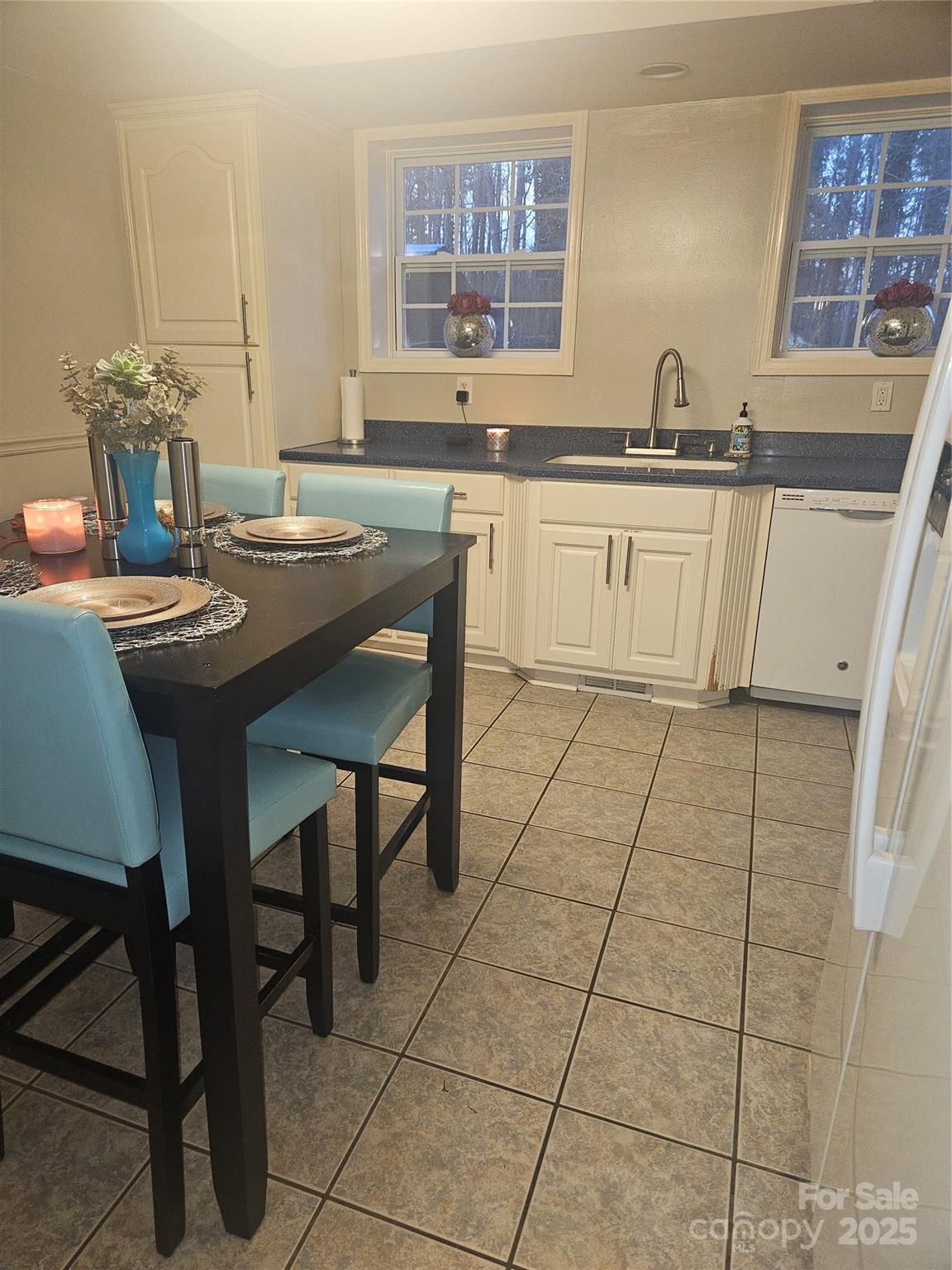 313 Mountain Creek Road Albemarle, NC 28001 - Photo 13 of 25 a kitchen with stainless steel appliances a sink stove and cabinets