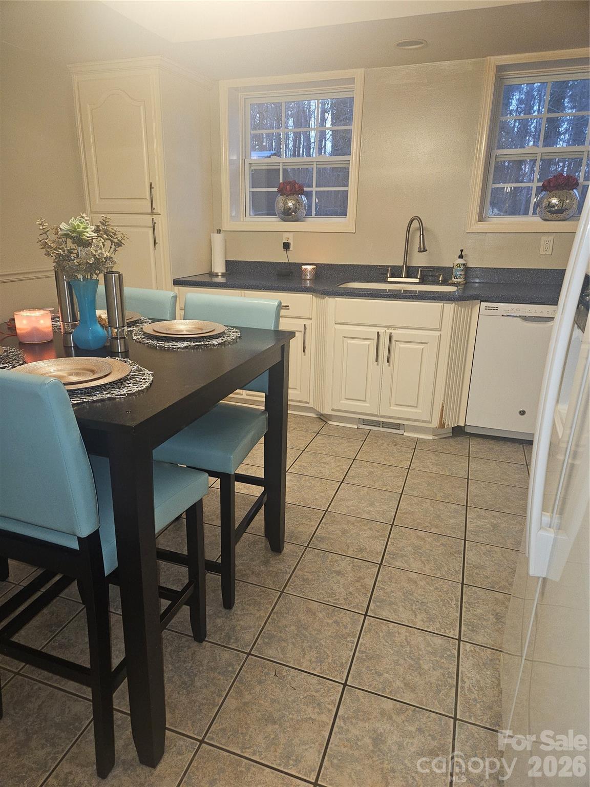 313 Mountain Creek Road Albemarle, NC 28001 - Photo 14 of 23 a kitchen with stainless steel appliances a sink stove and cabinets