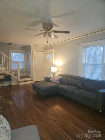 a living room with furniture and fireplace