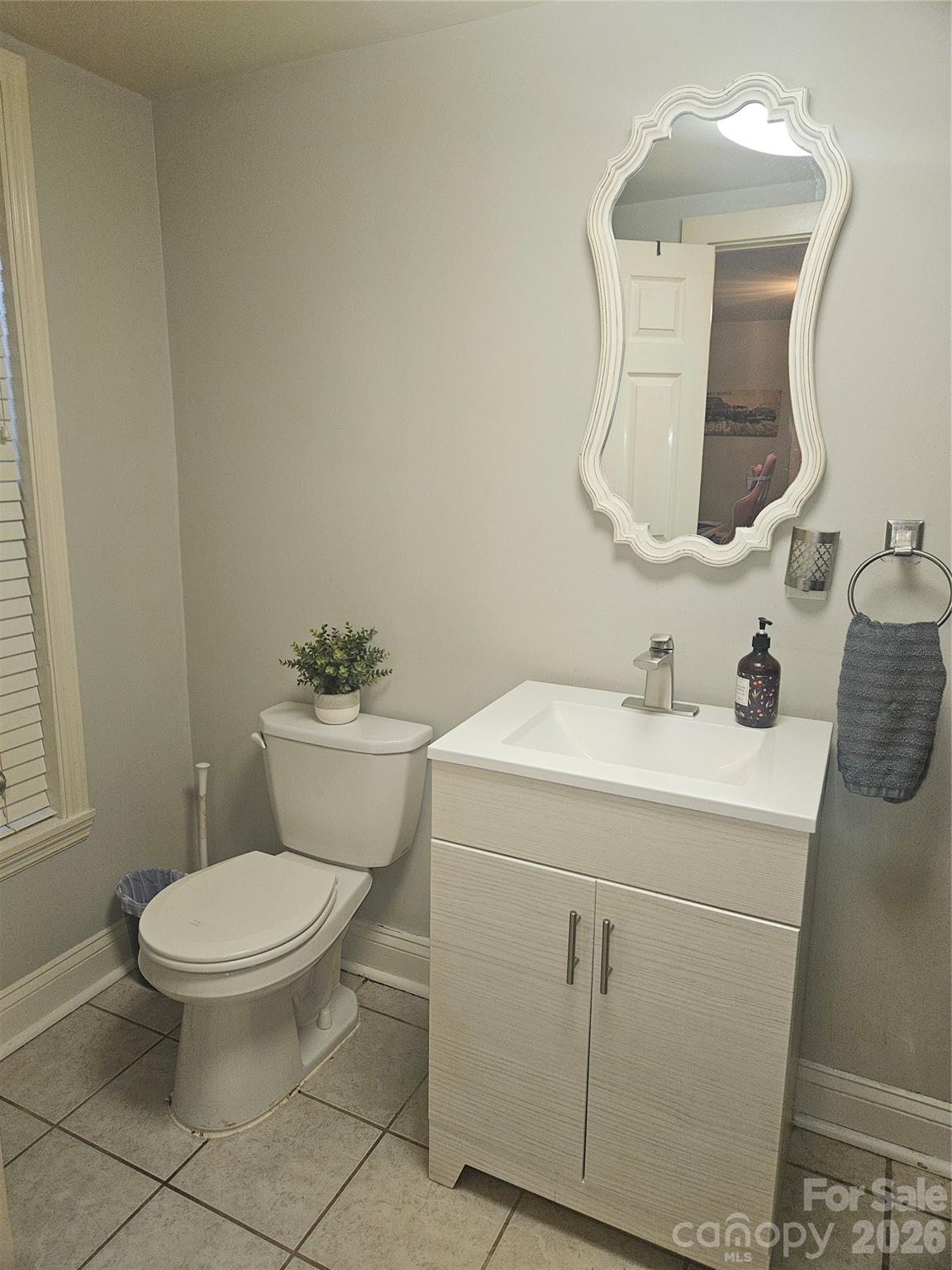 313 Mountain Creek Road Albemarle, NC 28001 - Photo 16 of 23 a bathroom with a toilet sink and mirror