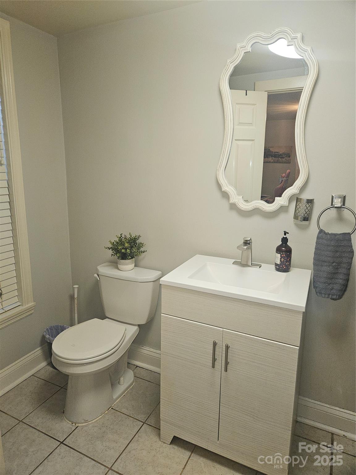 313 Mountain Creek Road Albemarle, NC 28001 - Photo 20 of 25 a bathroom with a toilet sink and mirror